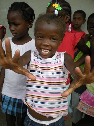 Girl showing clean hands after using filter