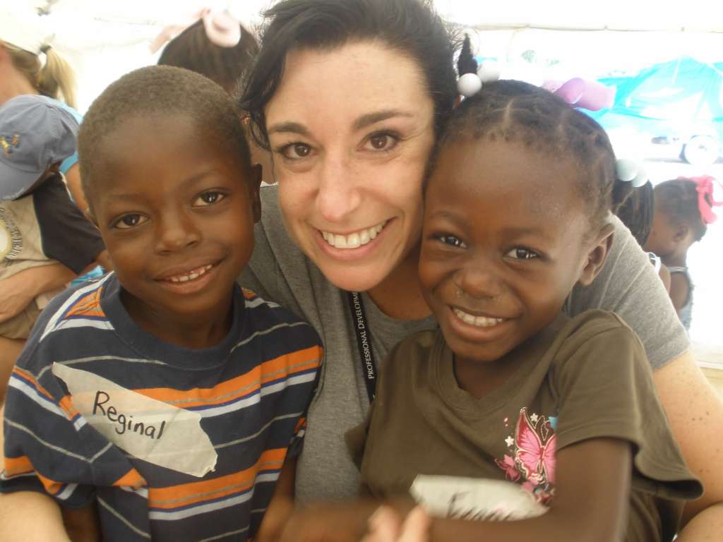 Jen with two Haitian children