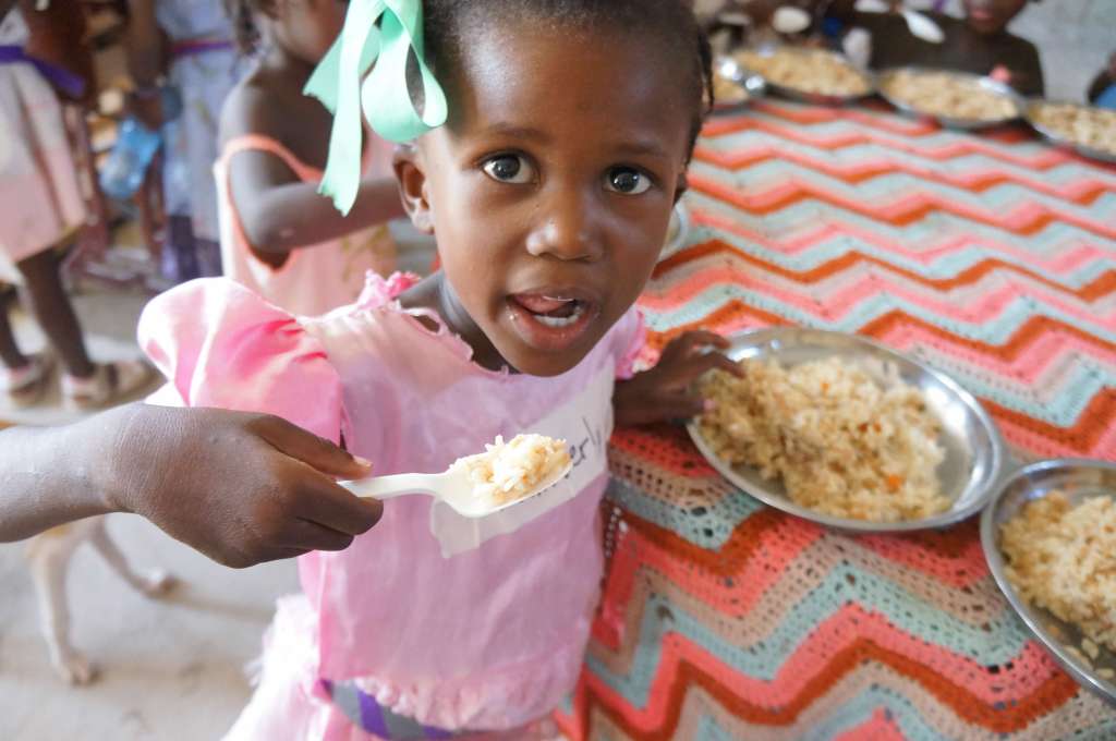 Girl eating food packaged by group