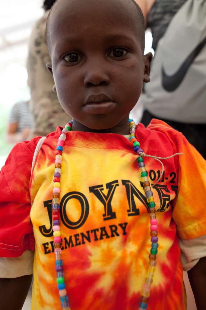 Haitian boy in Joyner Elementary School shirt